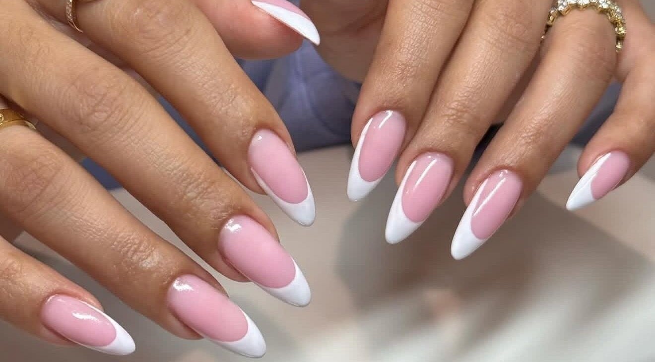 Elegant pink and white French manicured nails at Sole Beaut& Nail in Toronto, Ontario, CA.