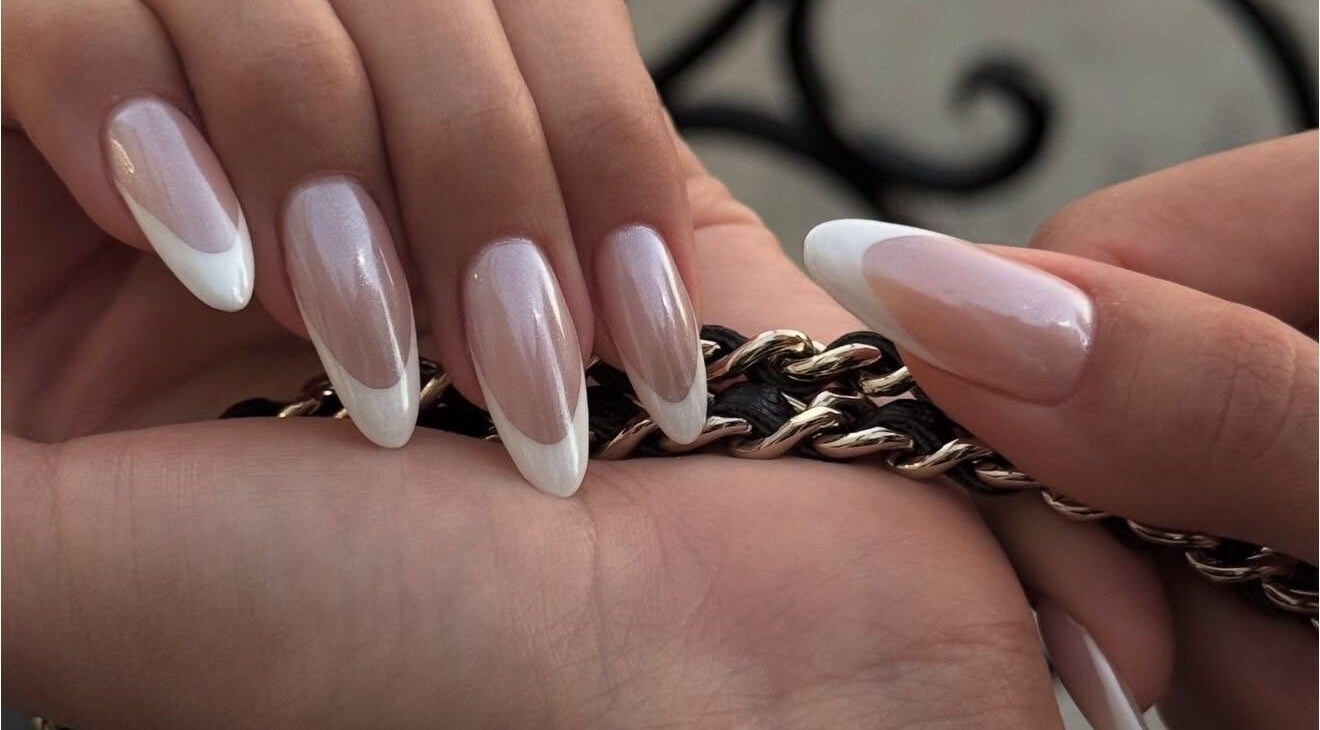 Close-up of French manicure nails at Sole Beaut& Nail, Toronto, Ontario, CA showcasing elegant nail art.