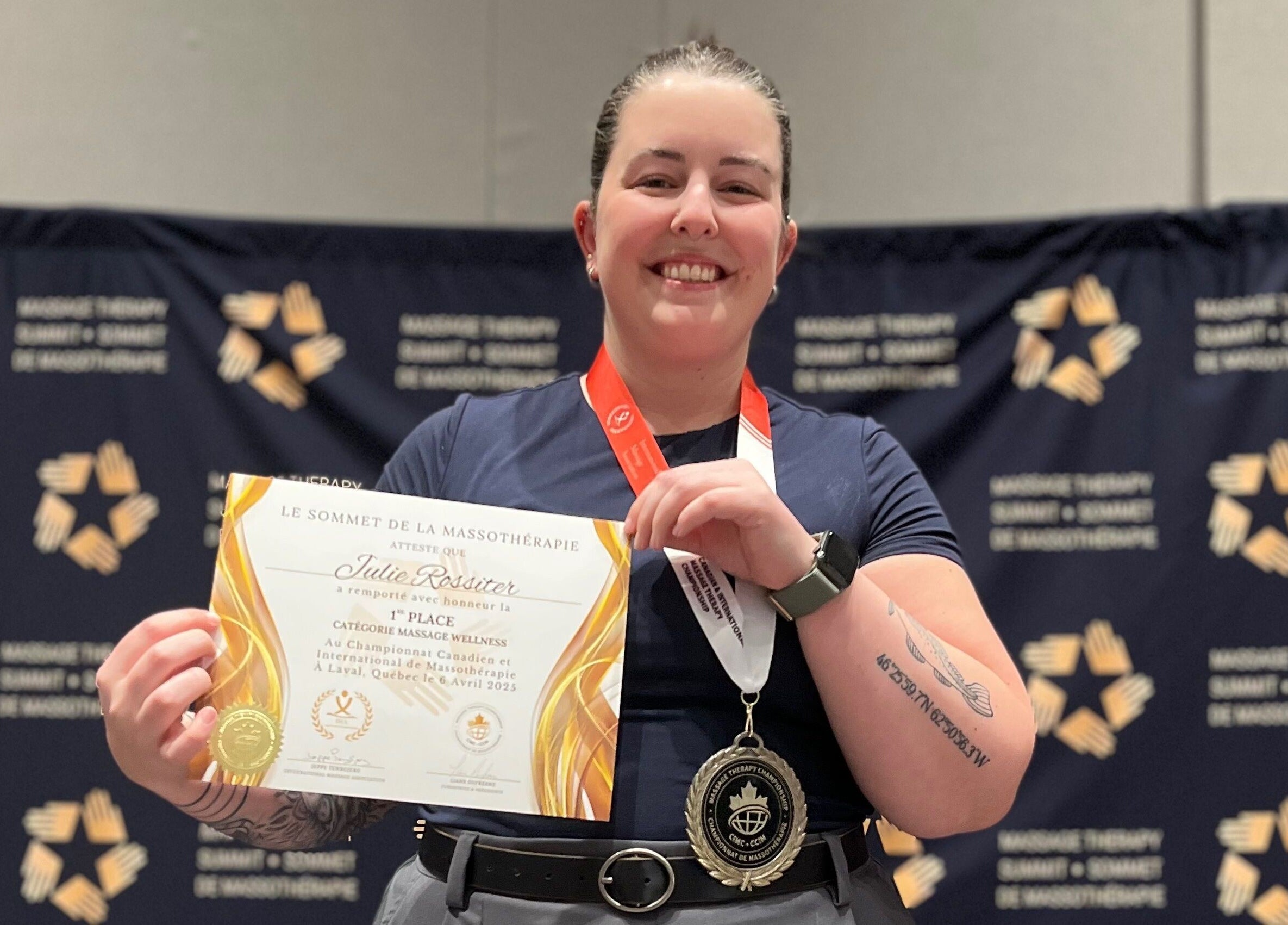 Julie Rossiter, wellness professional, proudly holding award at Laval, Québec, CA event.