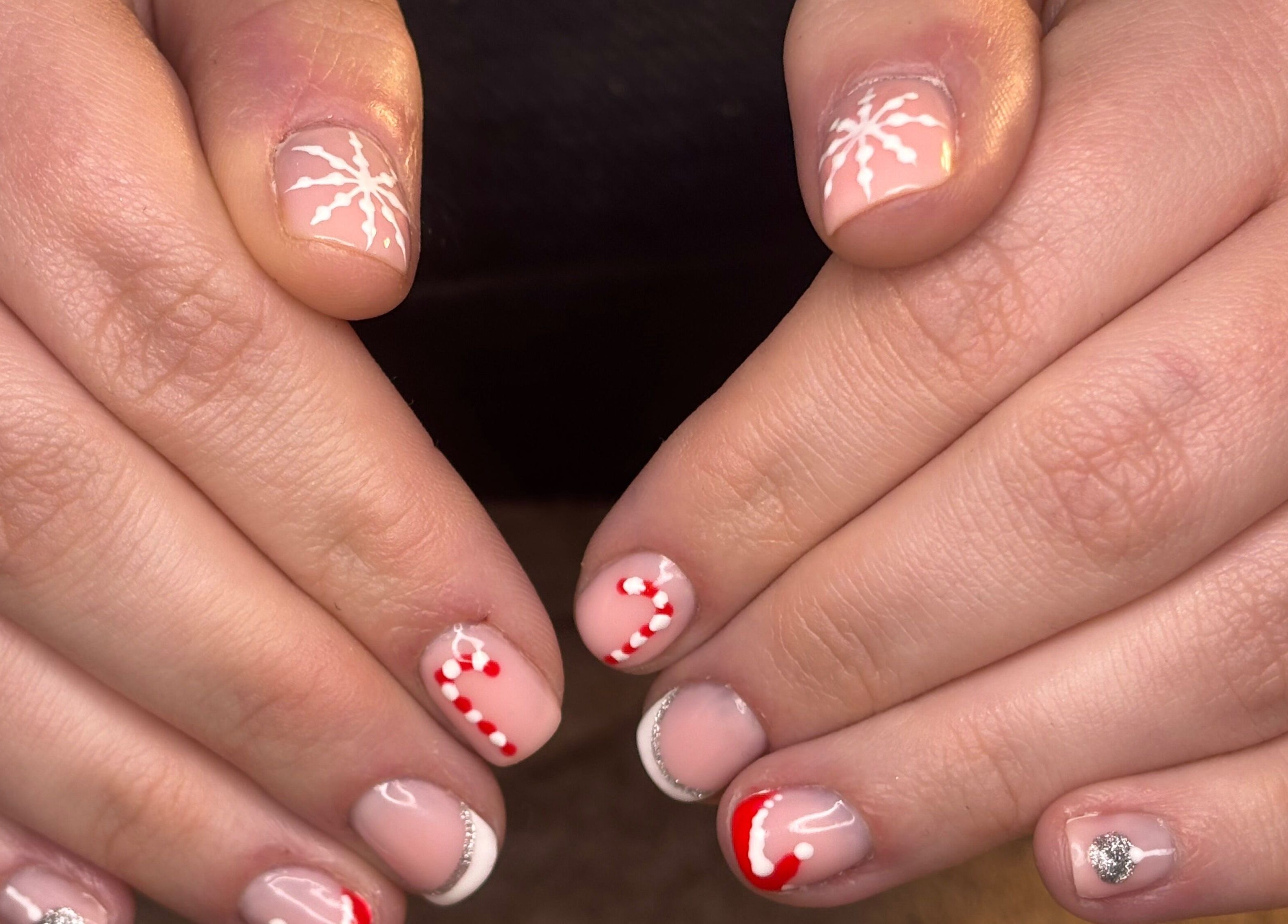 Candy cane nail art at Radiant Nails Mobile, Penwortham, England, GB. Perfect for holiday festivities.