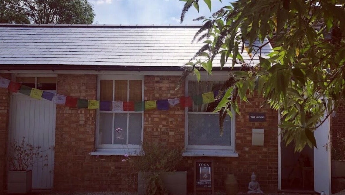 Exterior of Jess Clark Yoga Massage studio in Hitchin, England, GB, featuring serene decor and greenery.
