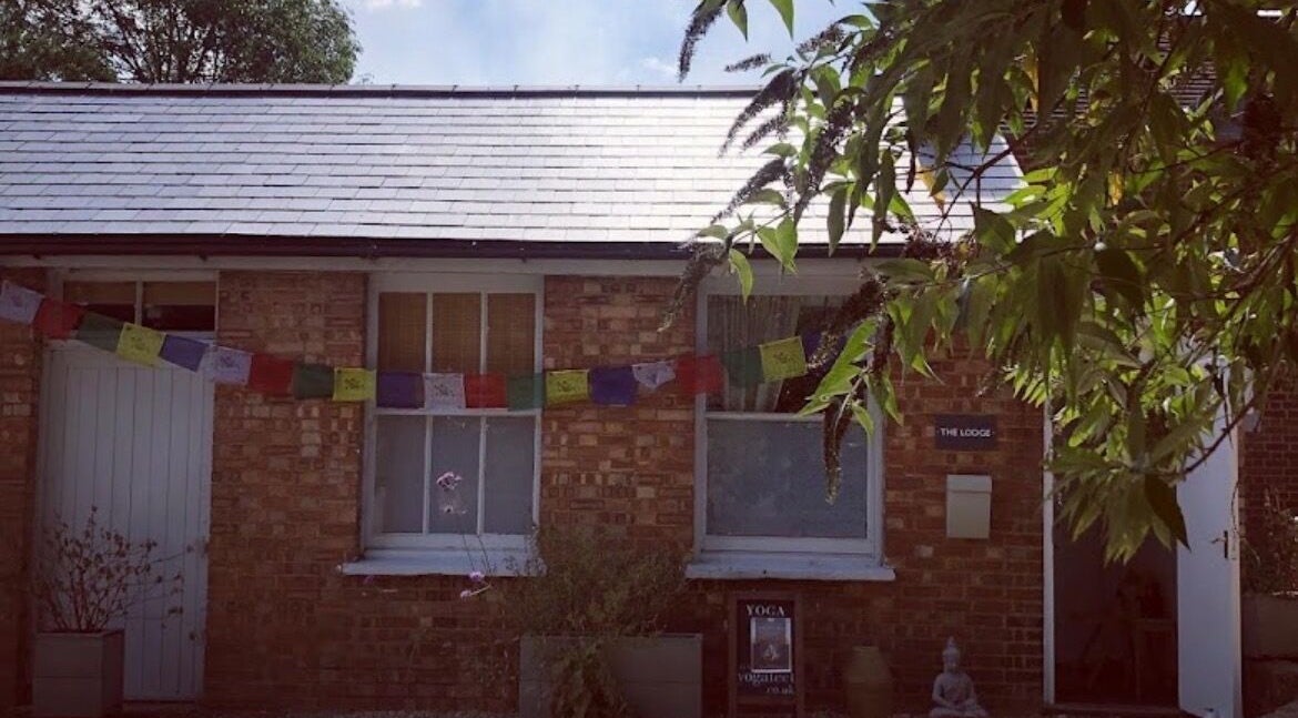 Exterior of Jess Clark Yoga Massage studio in Hitchin, England, GB, featuring serene decor and greenery.