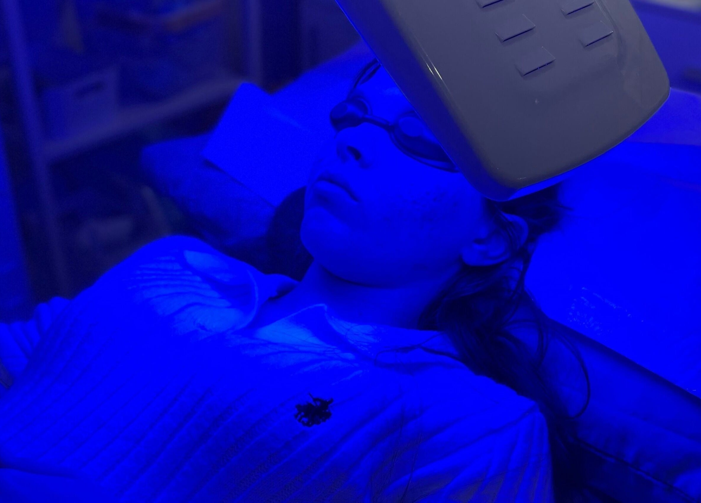 Blue light therapy session at Nunkeri Beauty in Forest Glen, Queensland, AU promoting skin wellness.