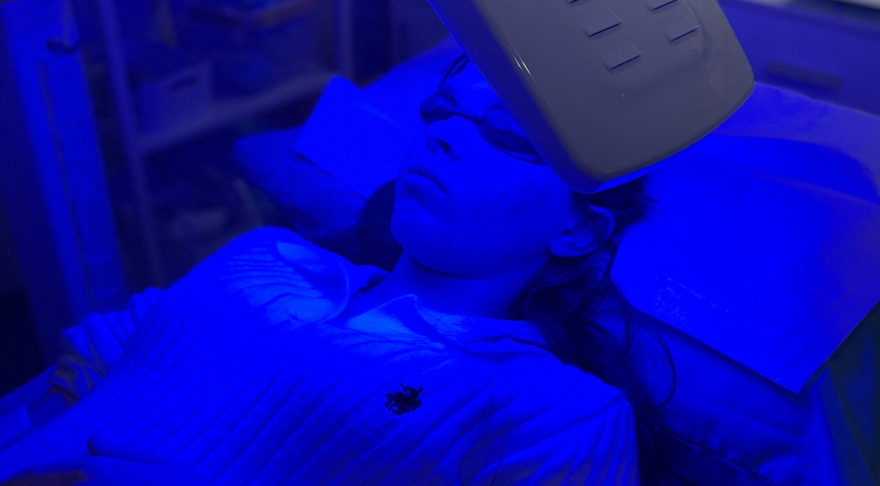 Blue light therapy session at Nunkeri Beauty in Forest Glen, Queensland, AU promoting skin wellness.