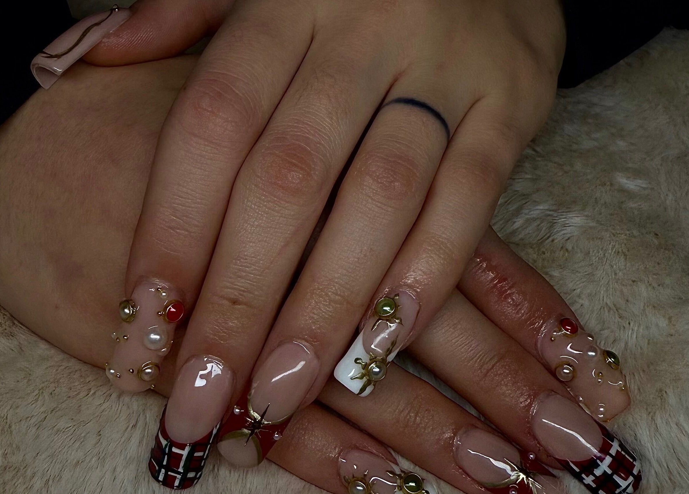 Intricate nail art with gems showcased at Angelsdenn, Watertown, New York, US.