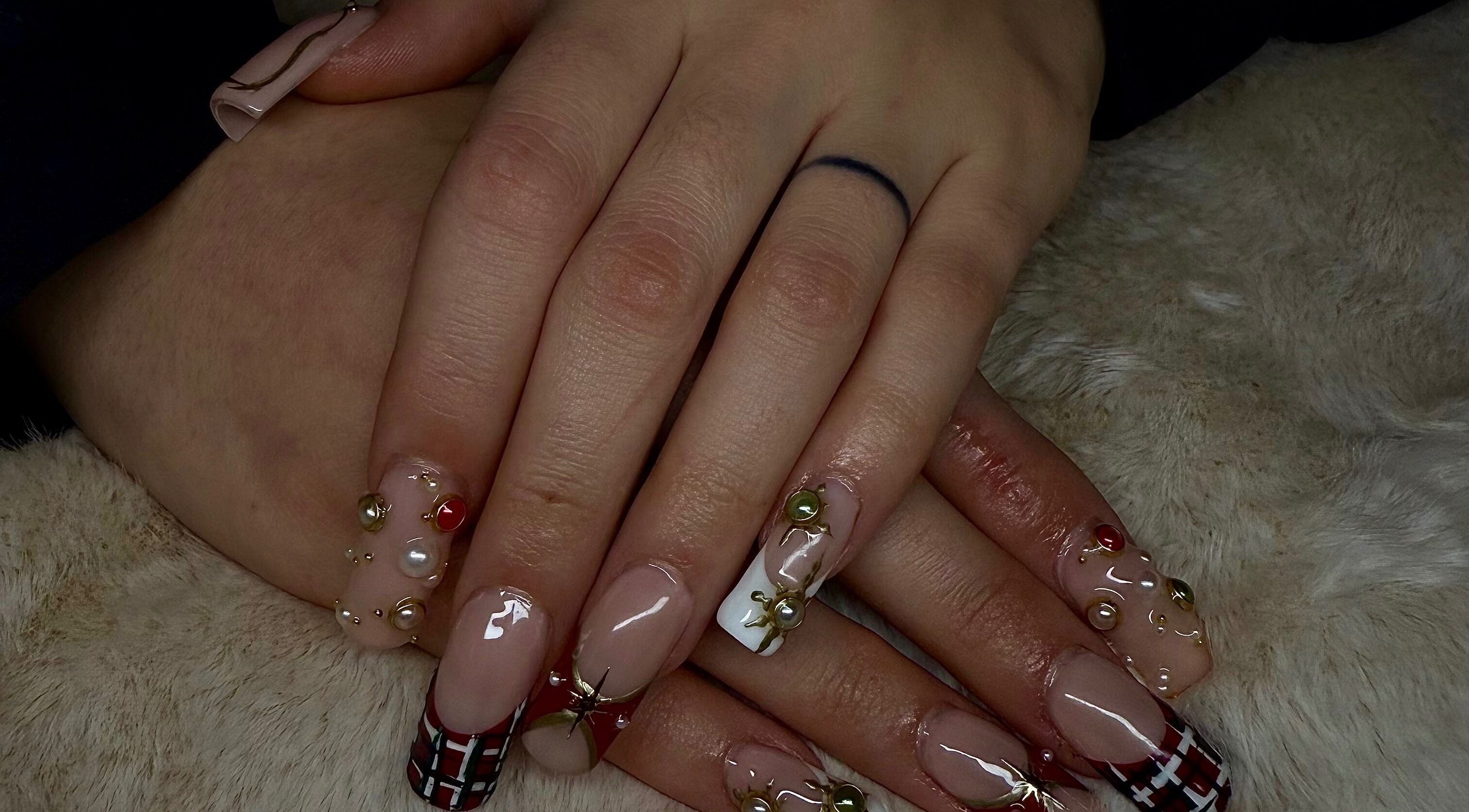 Intricate nail art with gems showcased at Angelsdenn, Watertown, New York, US.