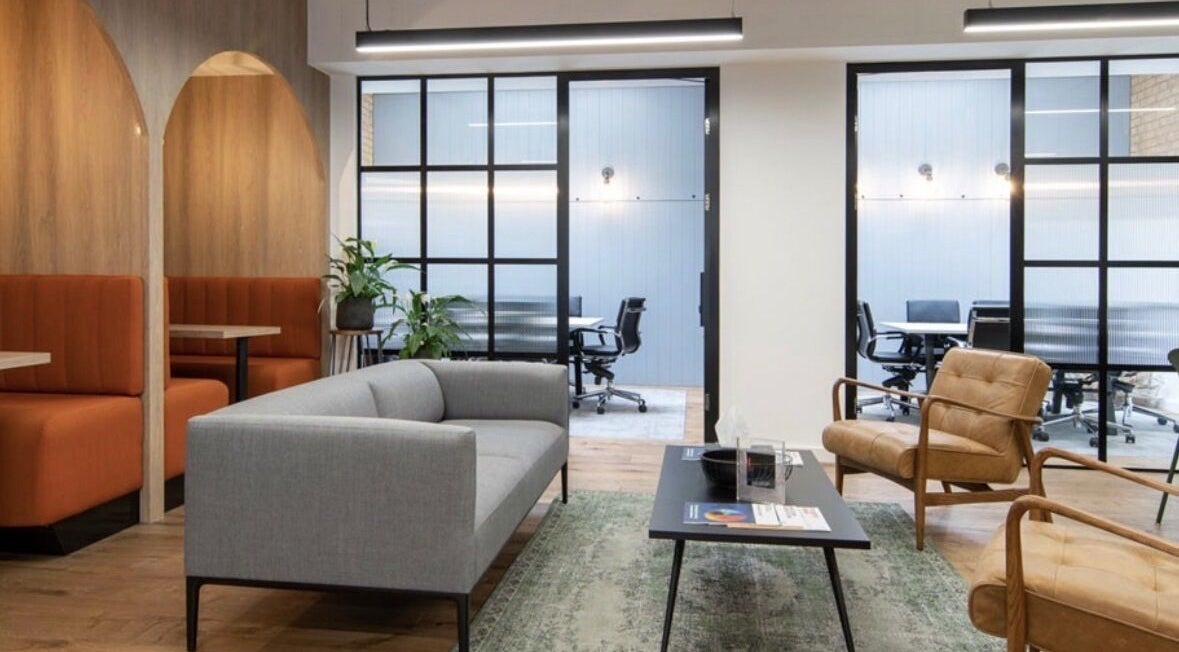 Modern lounge area at Iron Rice Bowl Coaching, Hong Kong, HK, featuring stylish sofas and chairs.