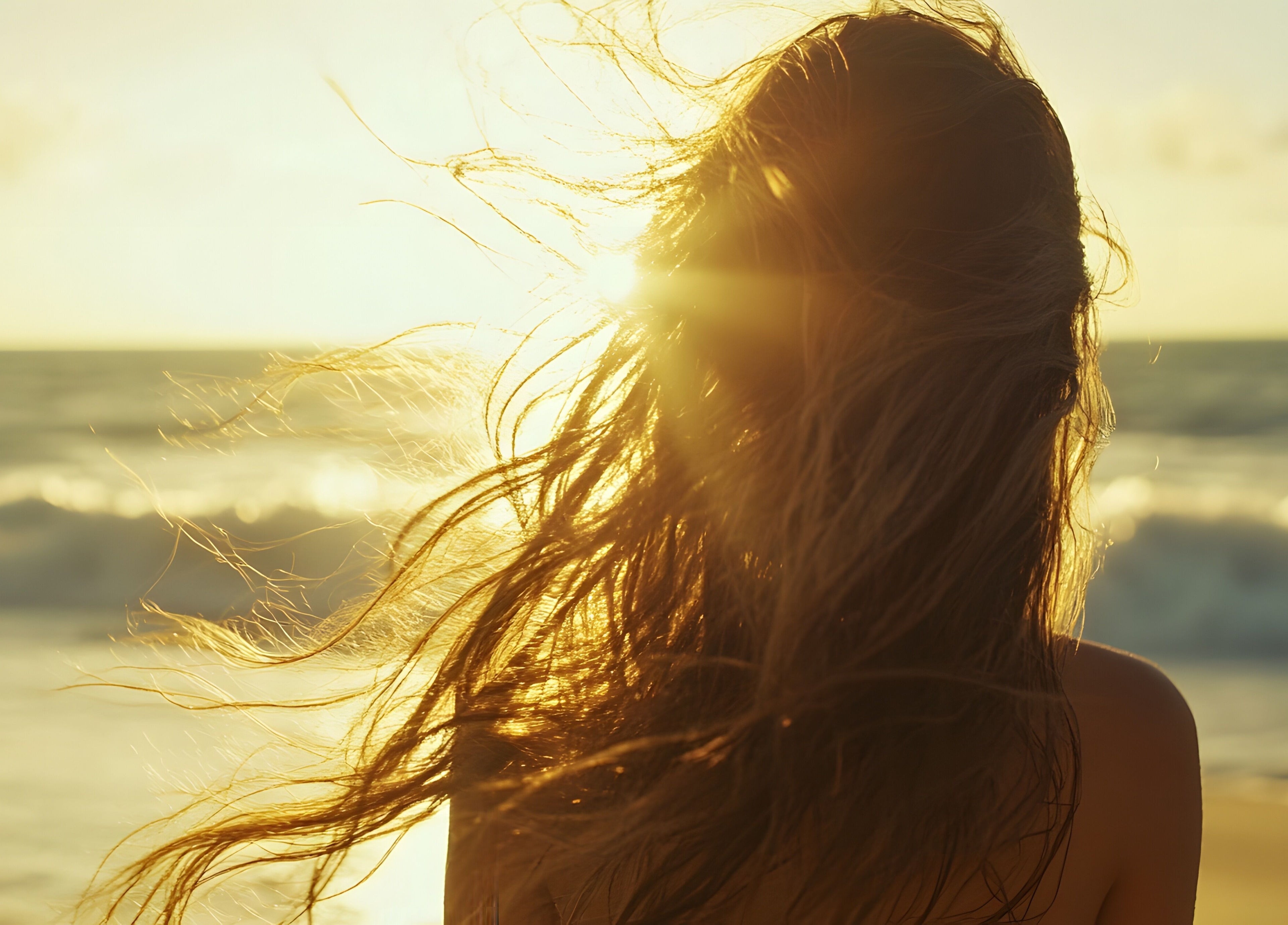Aloona Studio captures a woman enjoying sunset at Byron Bay, New South Wales, AU.