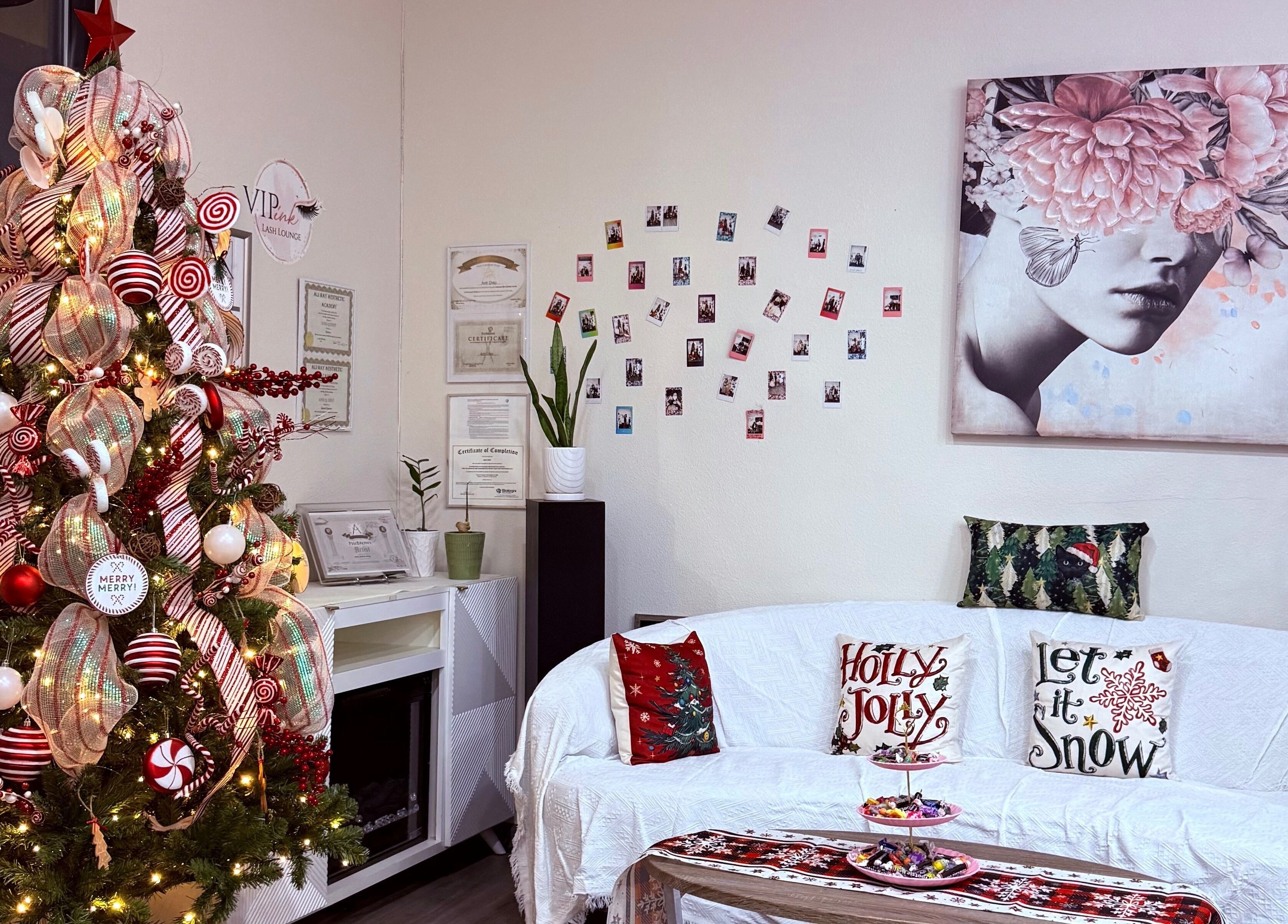 Cozy holiday decor at VIP Lash & Facial, Folsom, California, US featuring a festive tree and inviting seating.