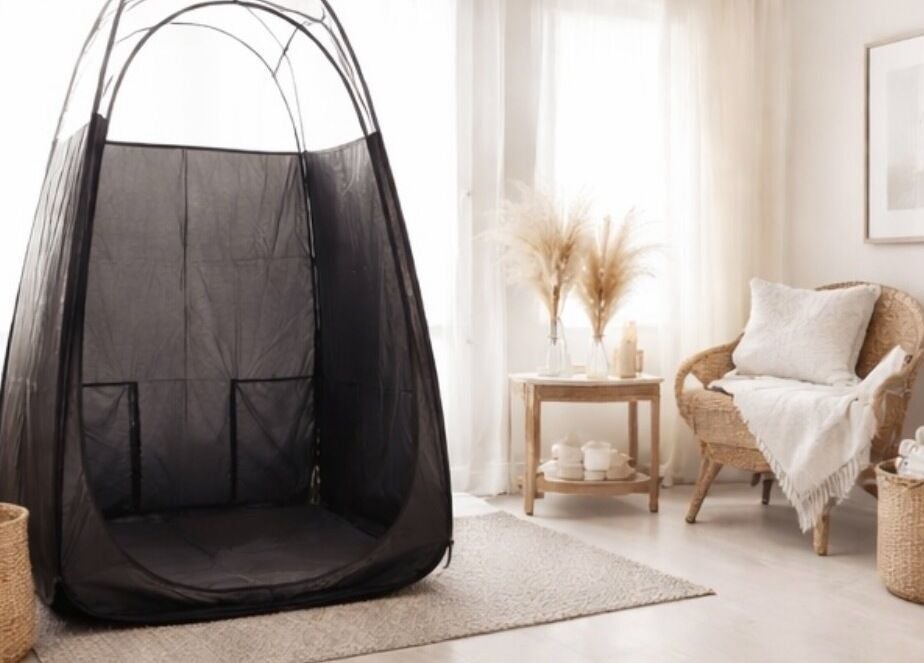 Cozy relaxation corner at Golden Edit, Surrey, British Columbia, CA with tanning tent and wicker chair.