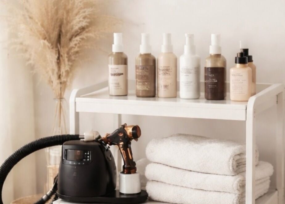 Golden Edit spa essentials in Surrey, British Columbia, CA featuring products and fresh towels.