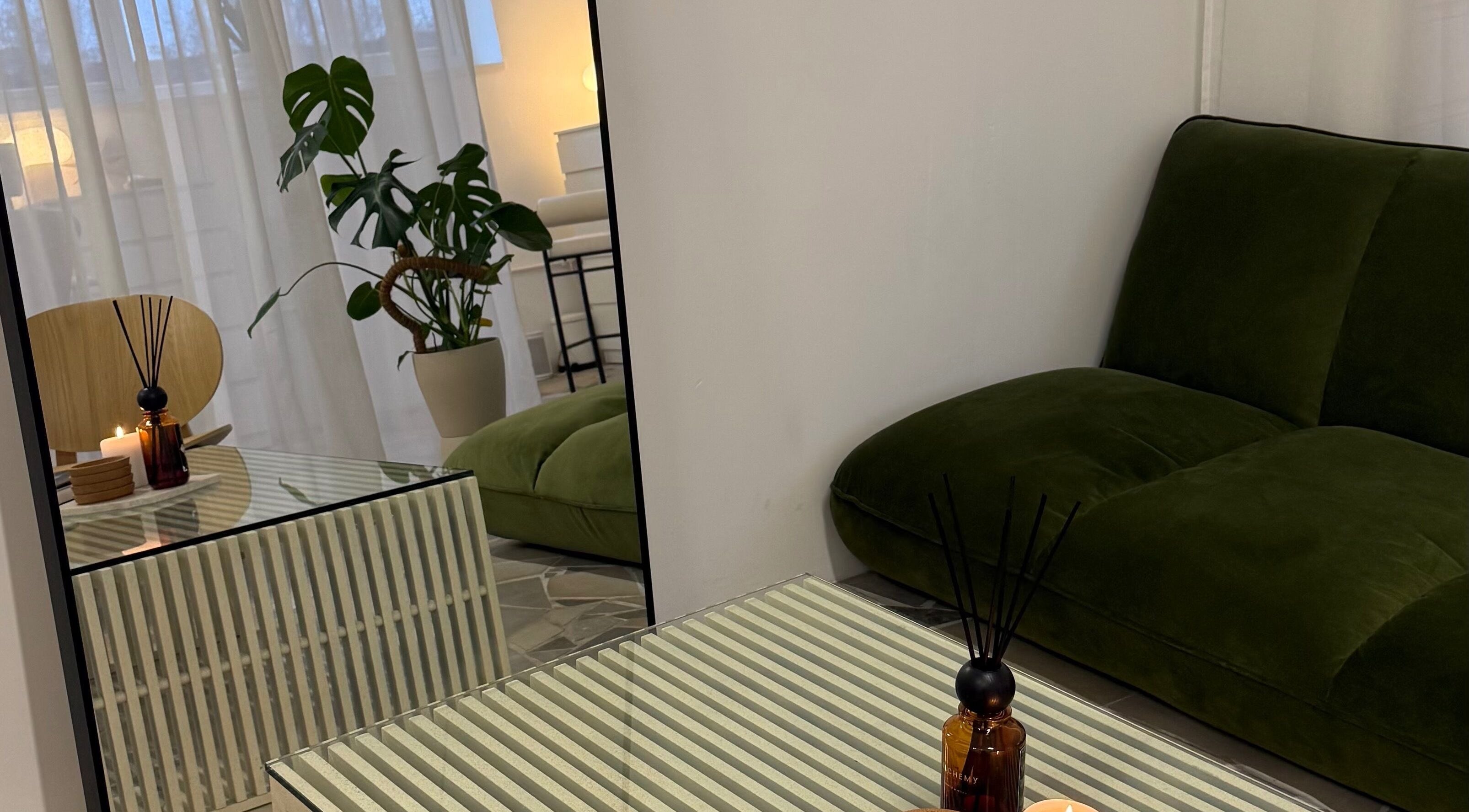 Relaxing lounge at Bymiaf, Salford, England, GB with green sofa and stylish decor.