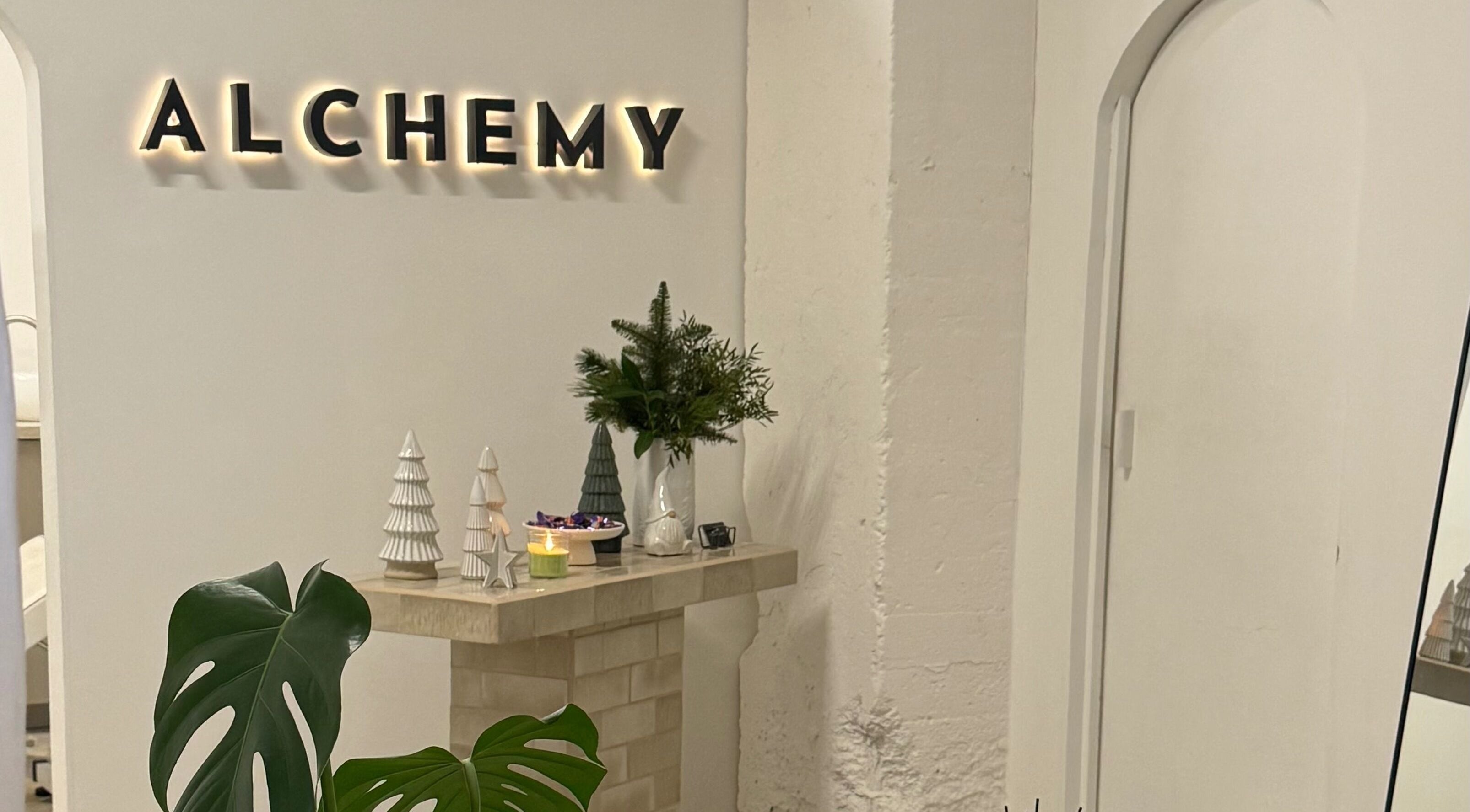 Elegant interior of Bymiaf in Salford, England, GB, featuring chic decor and a lush plant arrangement.