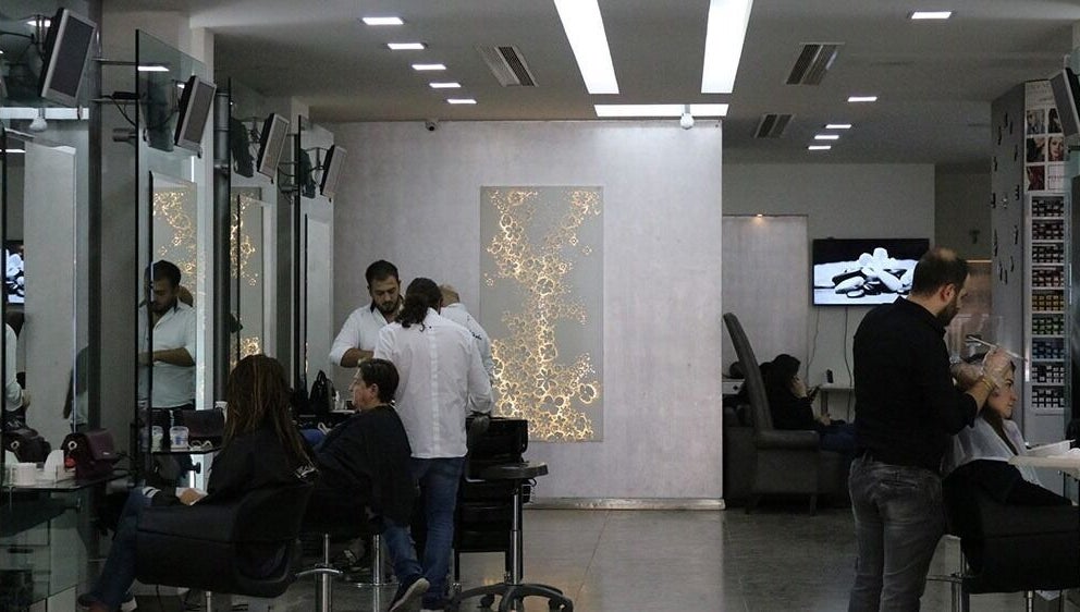 Modern interior of Salon Joseph Haber in North Governorate, LB showcasing hairstylists at work.