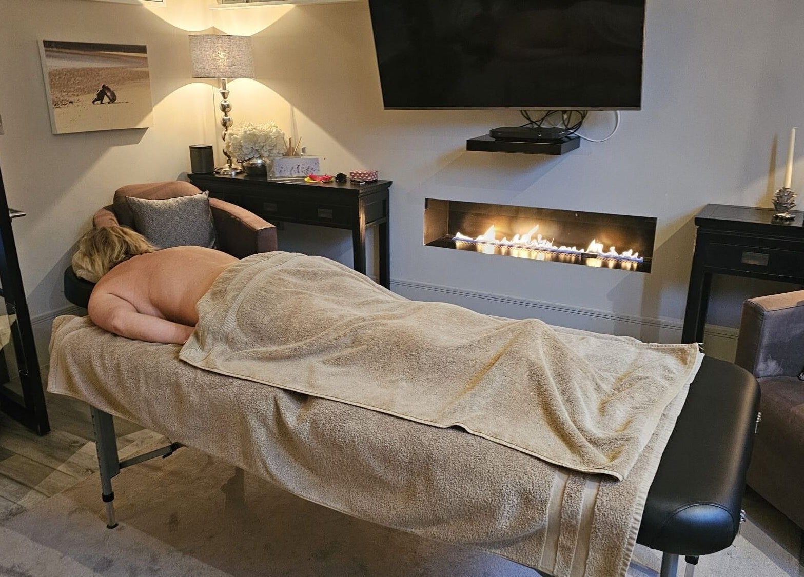 Relaxation scene at Healing Hands by Lisena LTD, London, England, GB, with a massage in a cozy room.