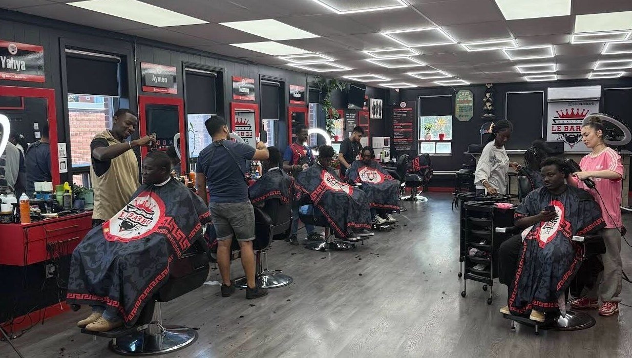 Els The Hairstylist salon in Montréal, Québec, CA, bustling with stylists crafting modern haircuts.