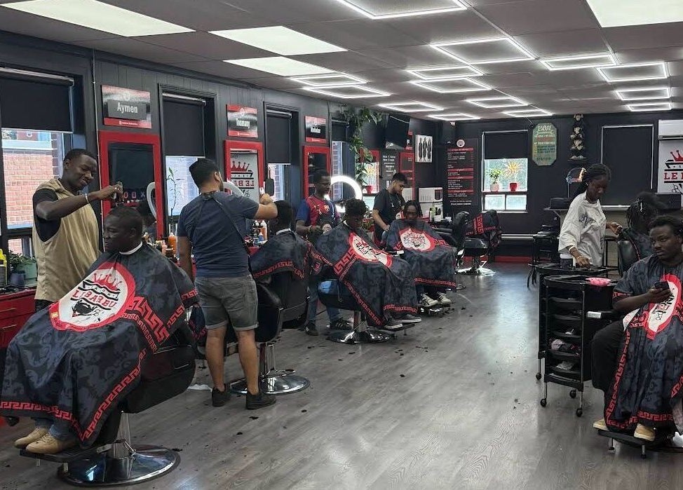 Els The Hairstylist salon in Montréal, Québec, CA, bustling with stylists crafting modern haircuts.