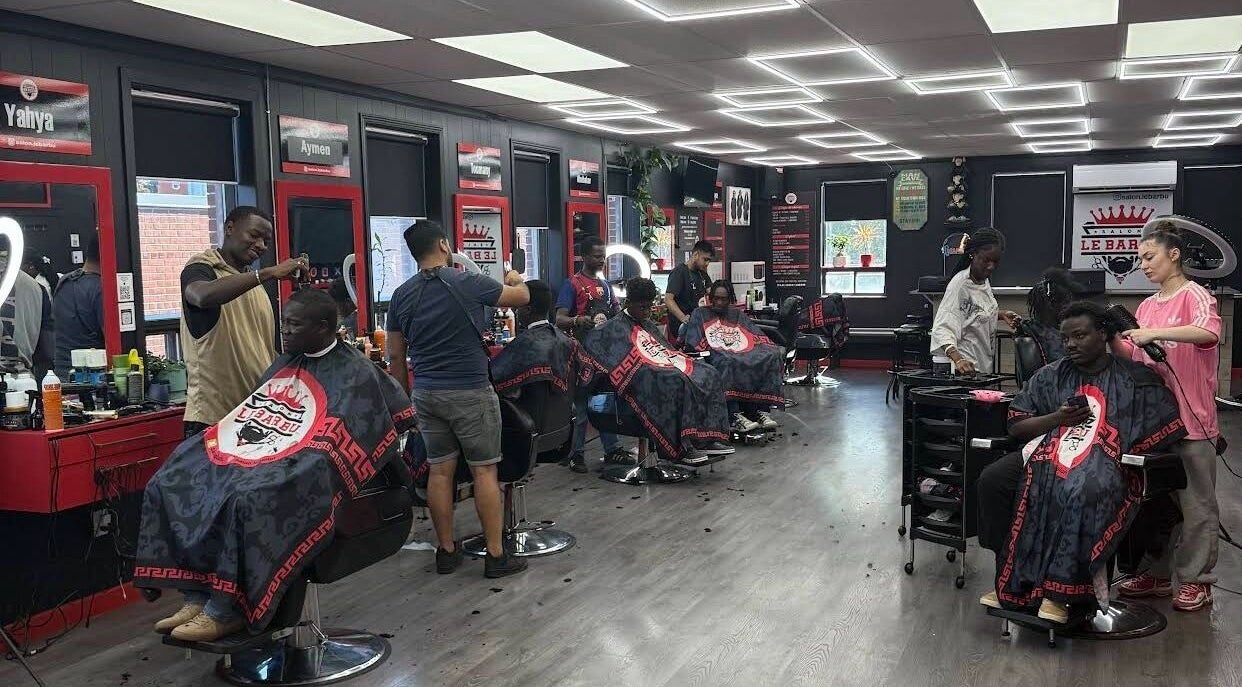 Els The Hairstylist salon in Montréal, Québec, CA, bustling with stylists crafting modern haircuts.