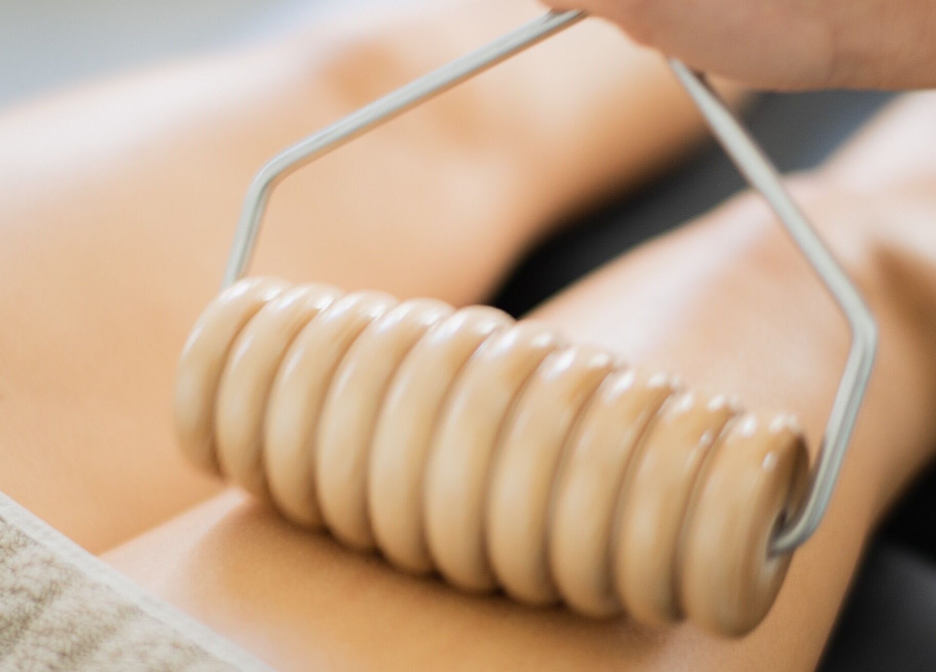 Body massage with a rolling tool at She Studio in Berlin, Berlin, DE for ultimate relaxation.