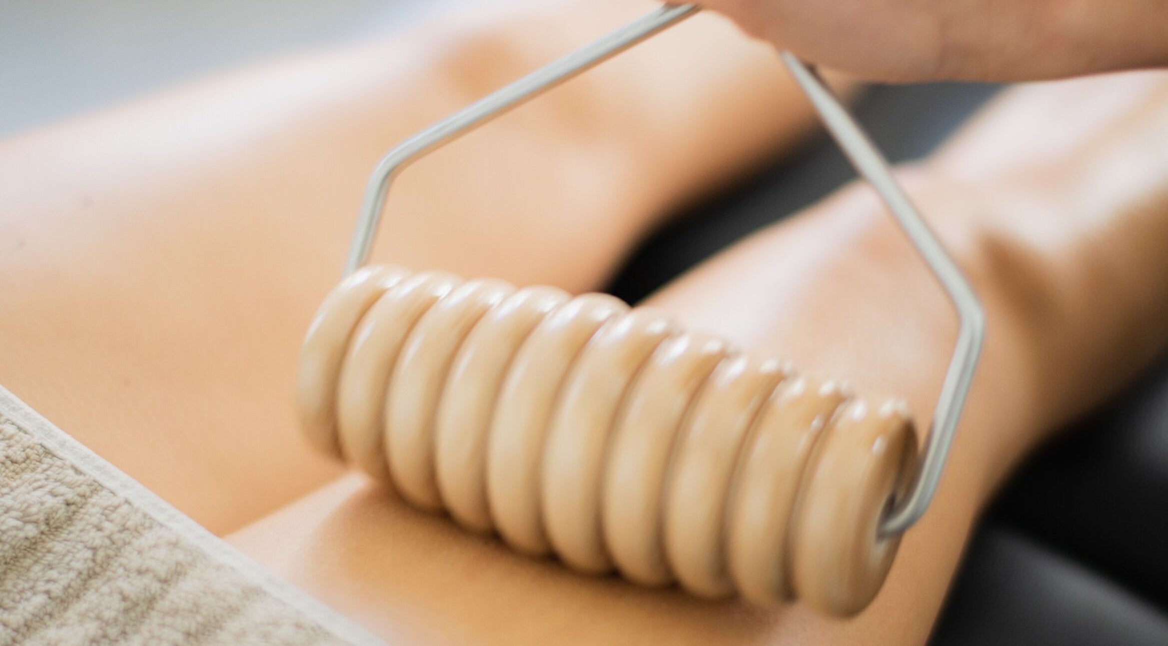 Body massage with a rolling tool at She Studio in Berlin, Berlin, DE for ultimate relaxation.