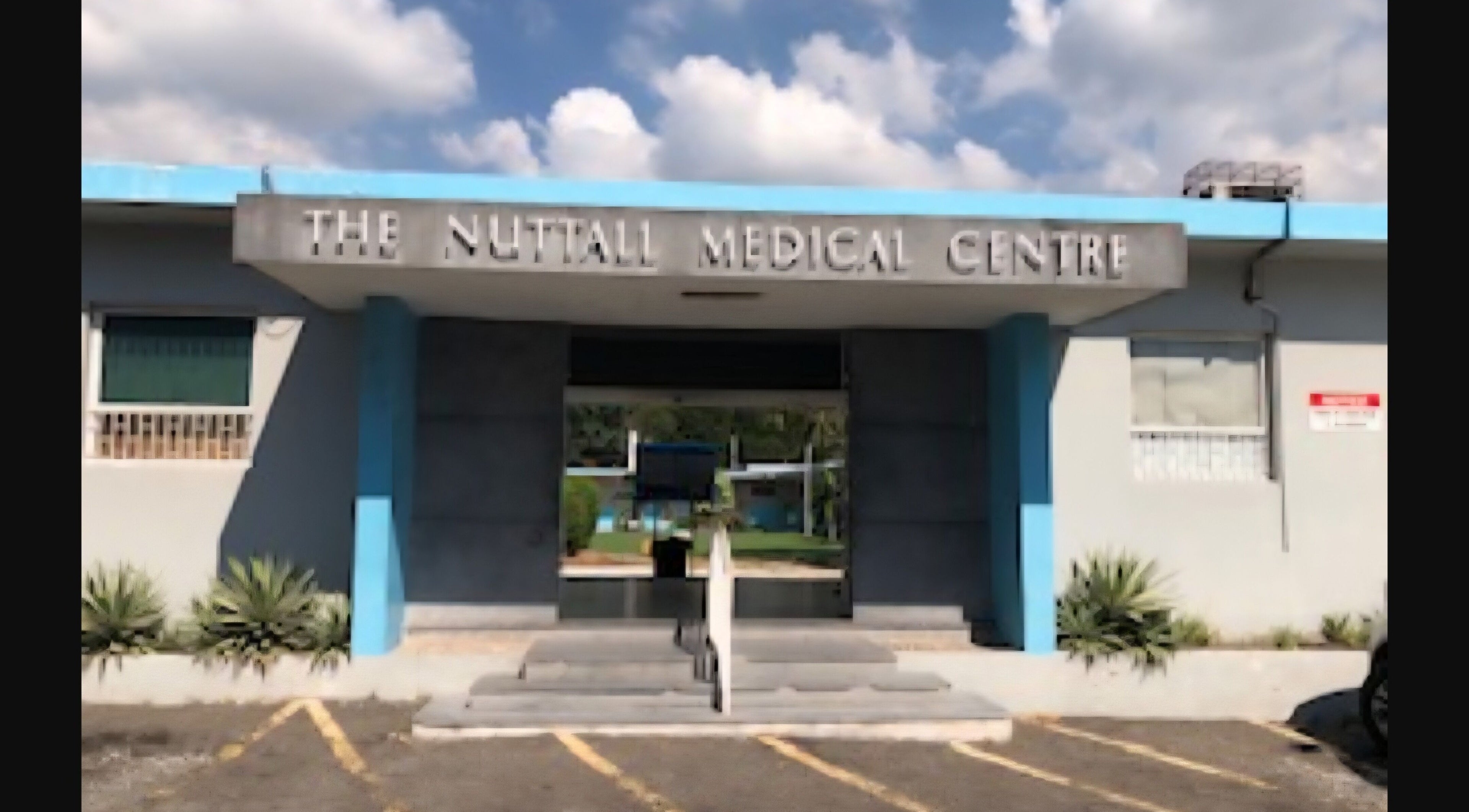 Entrance of Dr. Parsard Dermatology at Kingston, St. Andrew Parish, JM; modern architectural design.