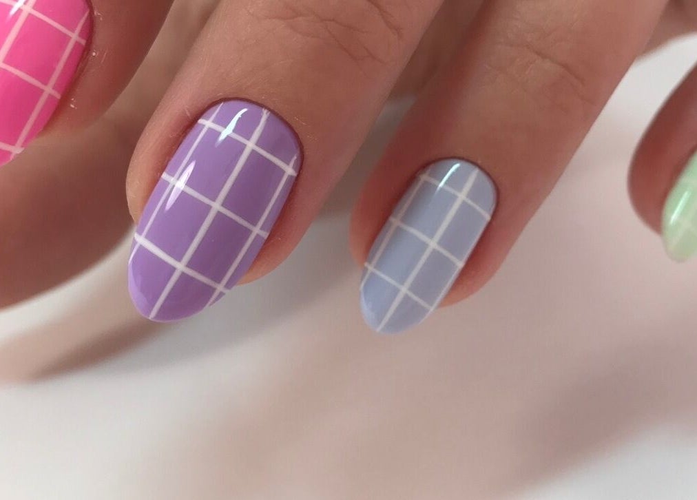 Colorful grid nail design at Amour Nails Midtown, New York, New York, US.