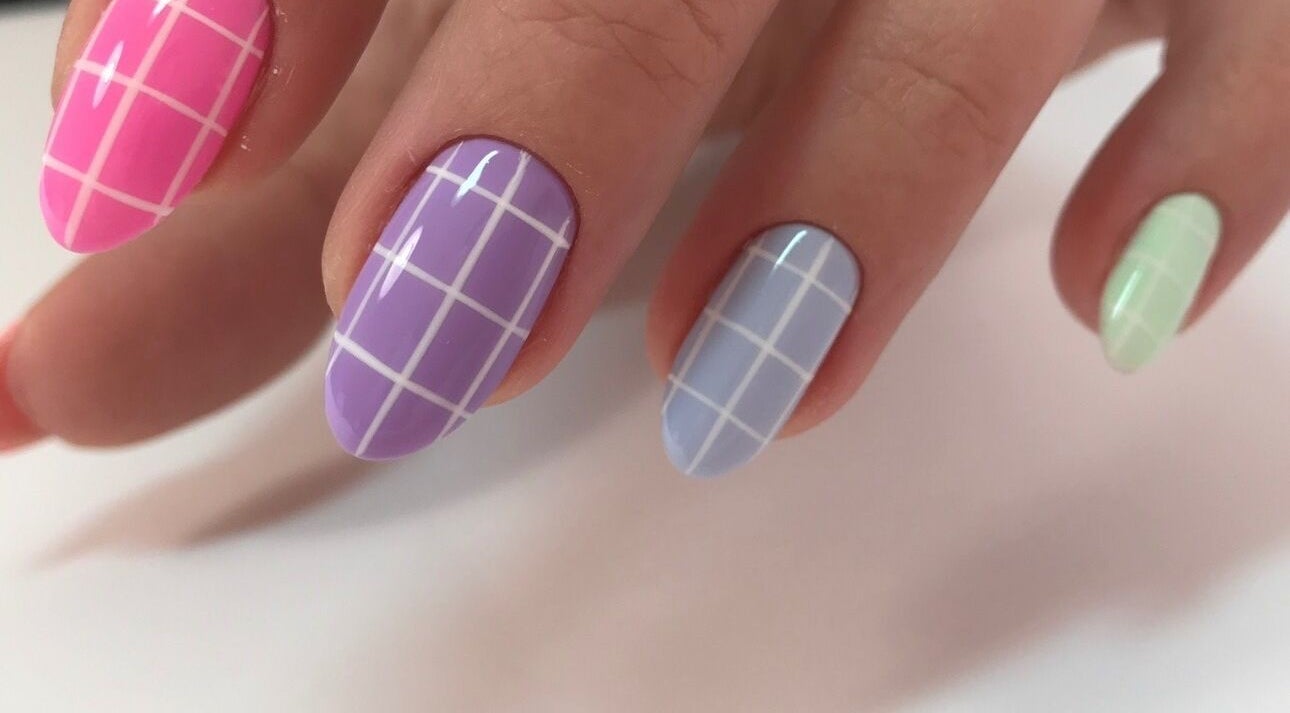 Colorful grid nail design at Amour Nails Midtown, New York, New York, US.