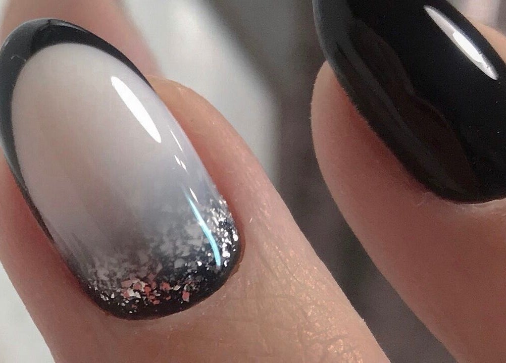 Stylish black and silver nail art at Amour Nails Midtown, New York, US. Perfect for a chic look.