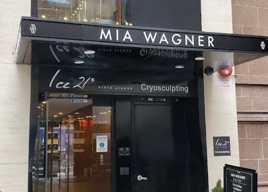 Elegant entrance to Amour Nails Midtown, New York, New York, US. Glass doors beneath black awning.