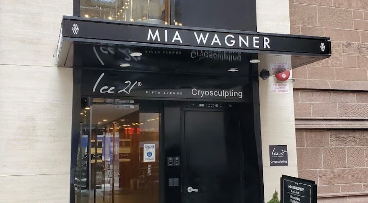 Elegant entrance to Amour Nails Midtown, New York, New York, US. Glass doors beneath black awning.