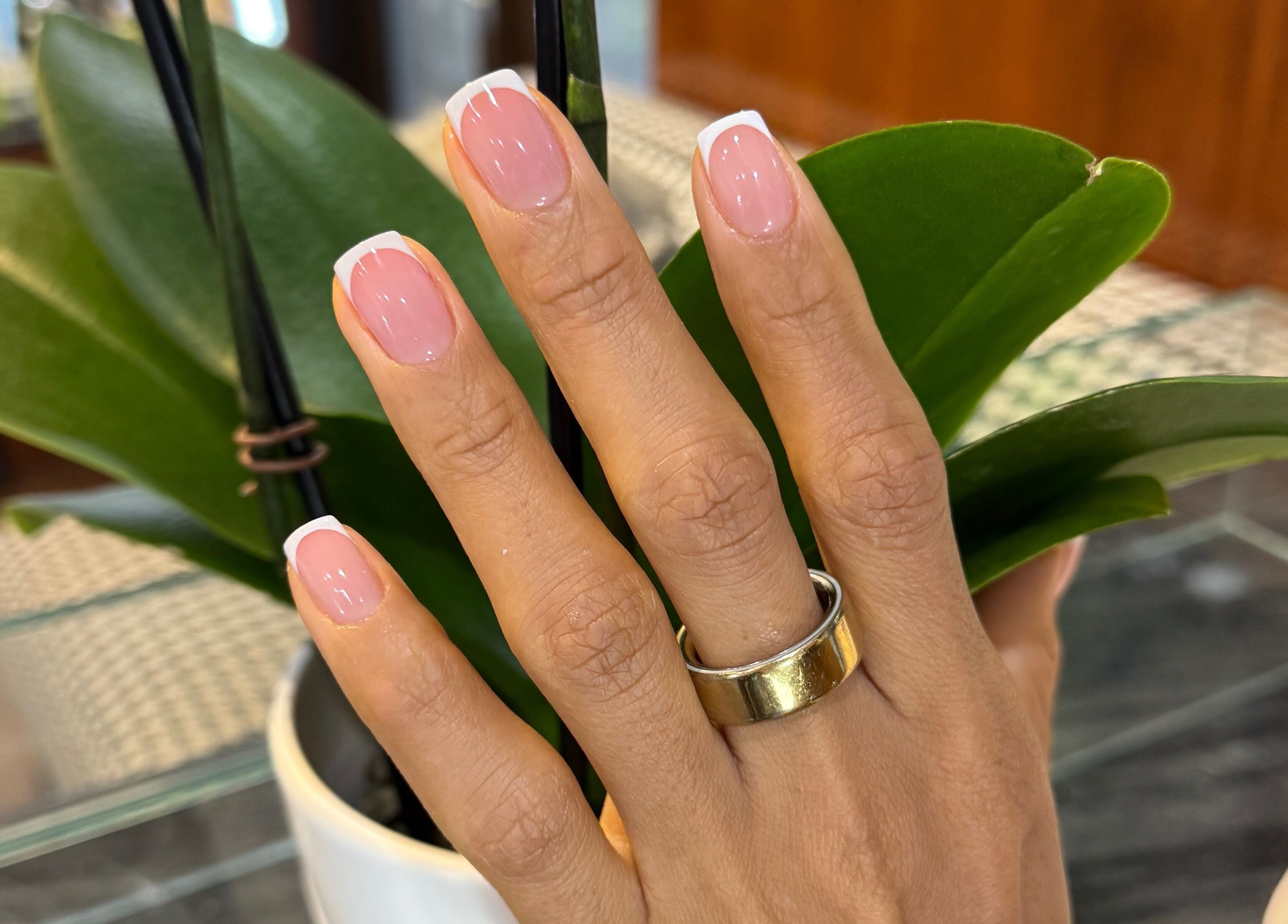 Elegant French manicure at Amour Nails Midtown, New York, New York, US showcasing chic style.
