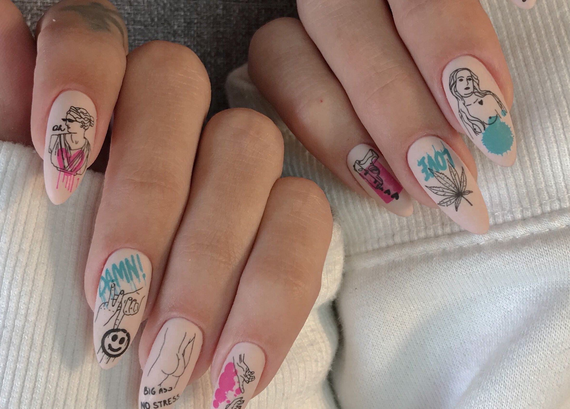 Artistic nail design at Amour Nails Midtown in New York, New York, US featuring creative graphics.