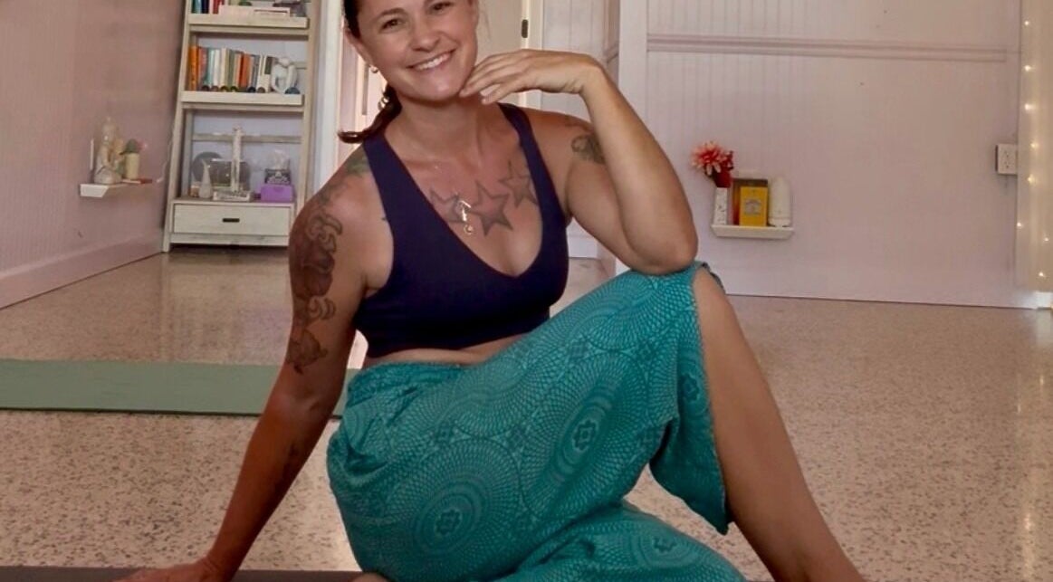Person in yoga pose at SoulVival Wellness, Merritt Island, Florida, US, showcasing calm and relaxation.