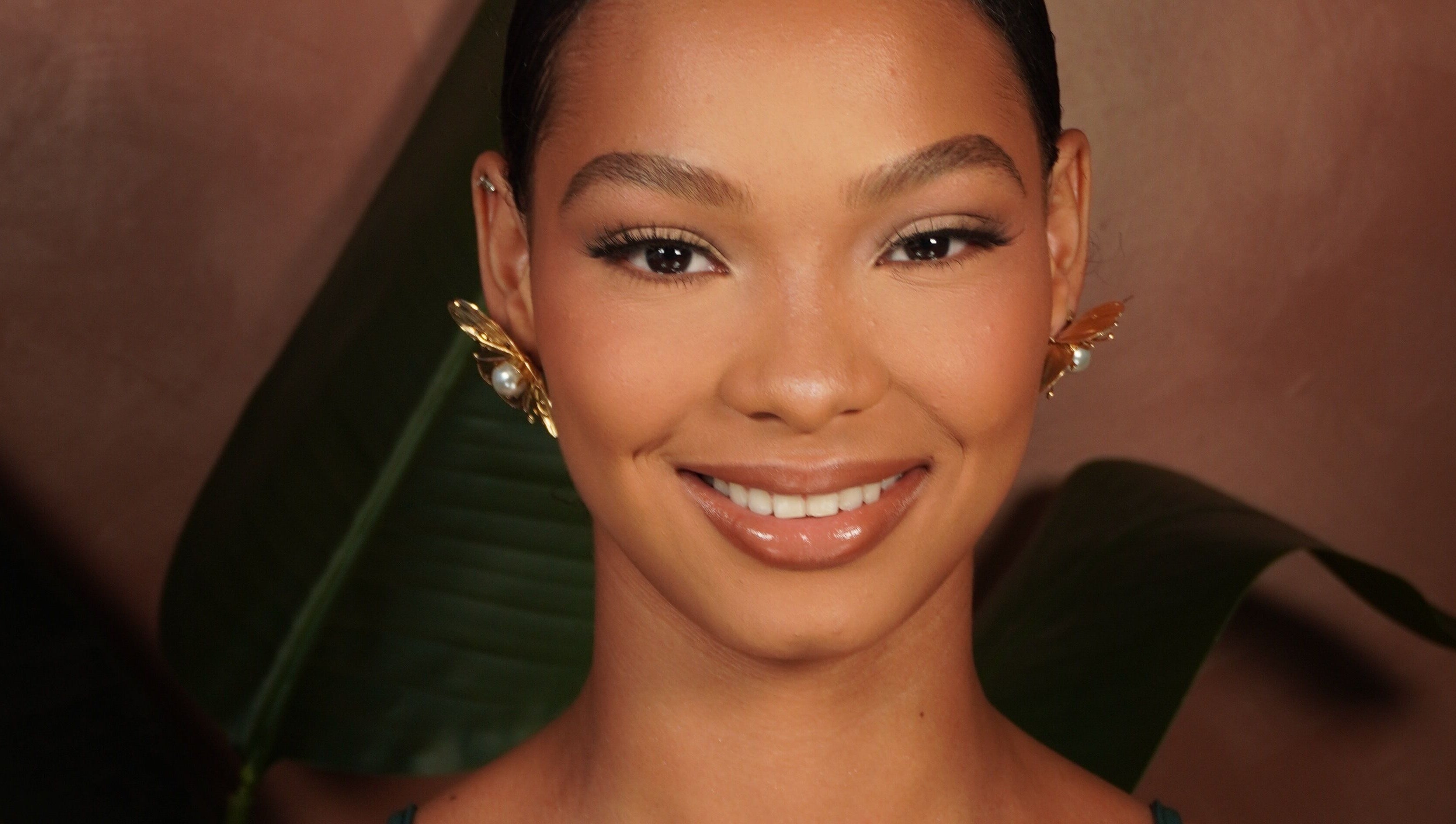 Close-up of a smiling woman with elegant makeup at Mykl Hues, Saint Augustine, Tunapuna/piarco Regional Corporation, TT.