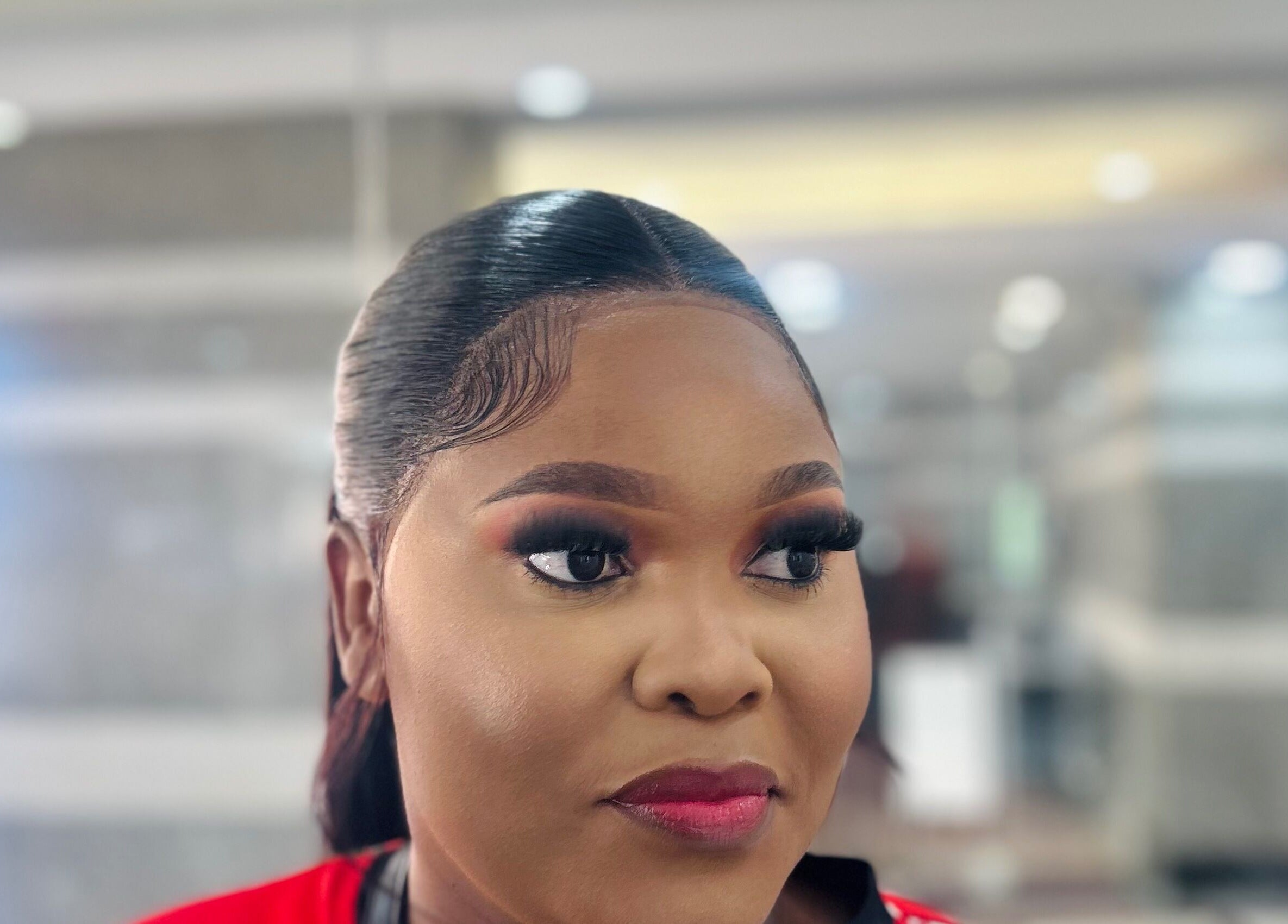 Woman with flawless makeup at Nathari Beauty Studio, Durban, ZA, showcasing expert beauty techniques.