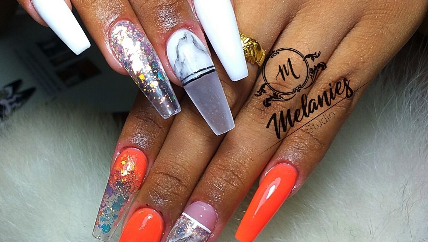 Stylish nail art at Melanies Studio, Paramaribo, Paramaribo, SR. Vibrant designs showcase expert manicure skills.