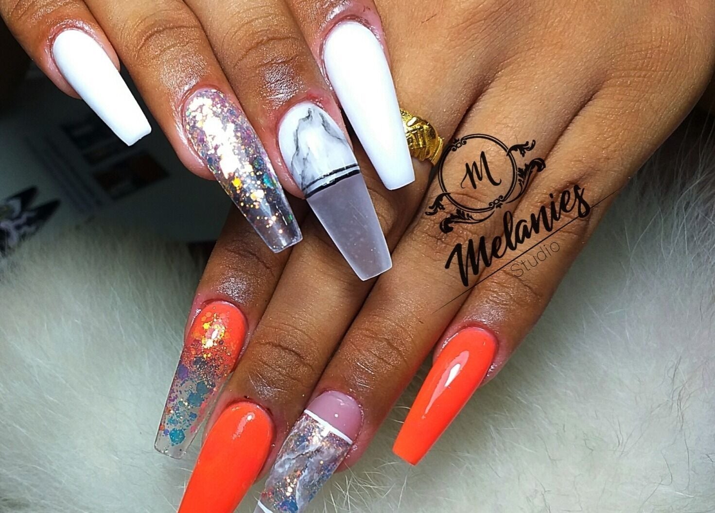 Stylish nail art at Melanies Studio, Paramaribo, Paramaribo, SR. Vibrant designs showcase expert manicure skills.