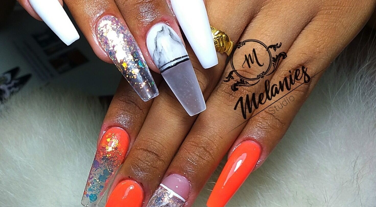 Stylish nail art at Melanies Studio, Paramaribo, Paramaribo, SR. Vibrant designs showcase expert manicure skills.