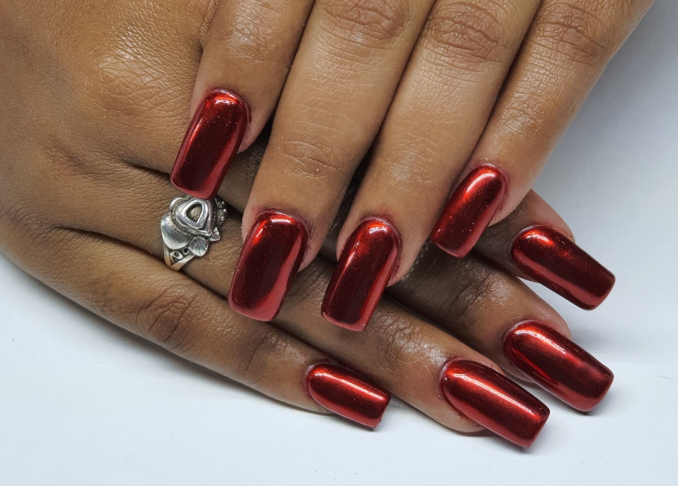 Stunning red nail art at Melanies Studio, Paramaribo, Paramaribo, SR, showcasing elegance and style.