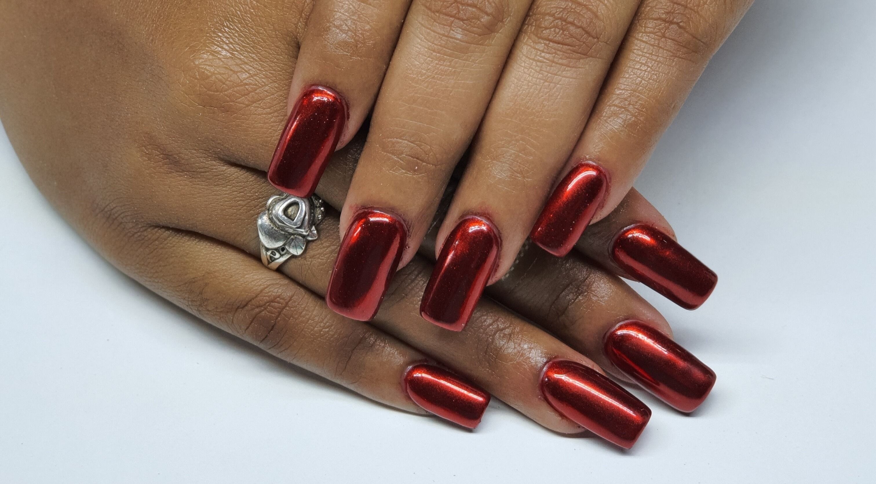 Stunning red nail art at Melanies Studio, Paramaribo, Paramaribo, SR, showcasing elegance and style.