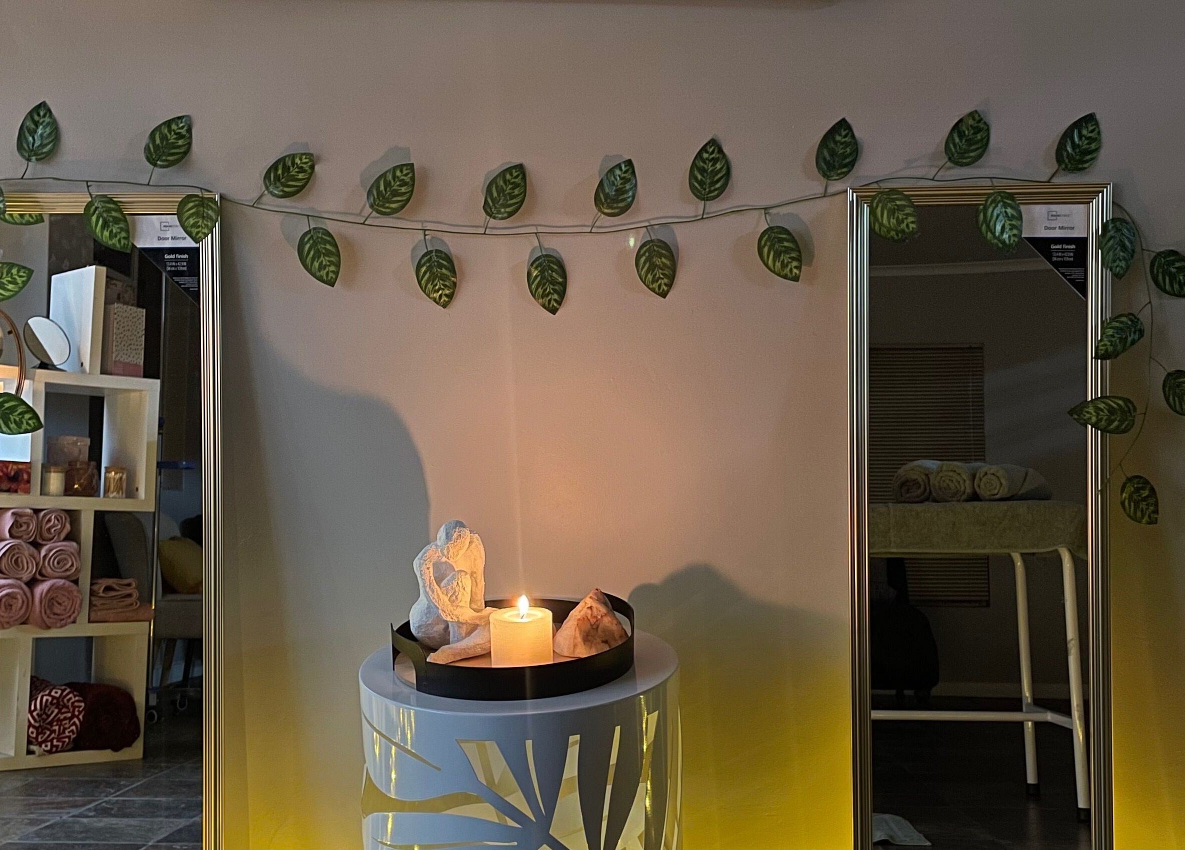 Soothing spa decor with candles and leaves at Wellness Empowerment Bridge Spa, Kimberley, Northern Cape, ZA.