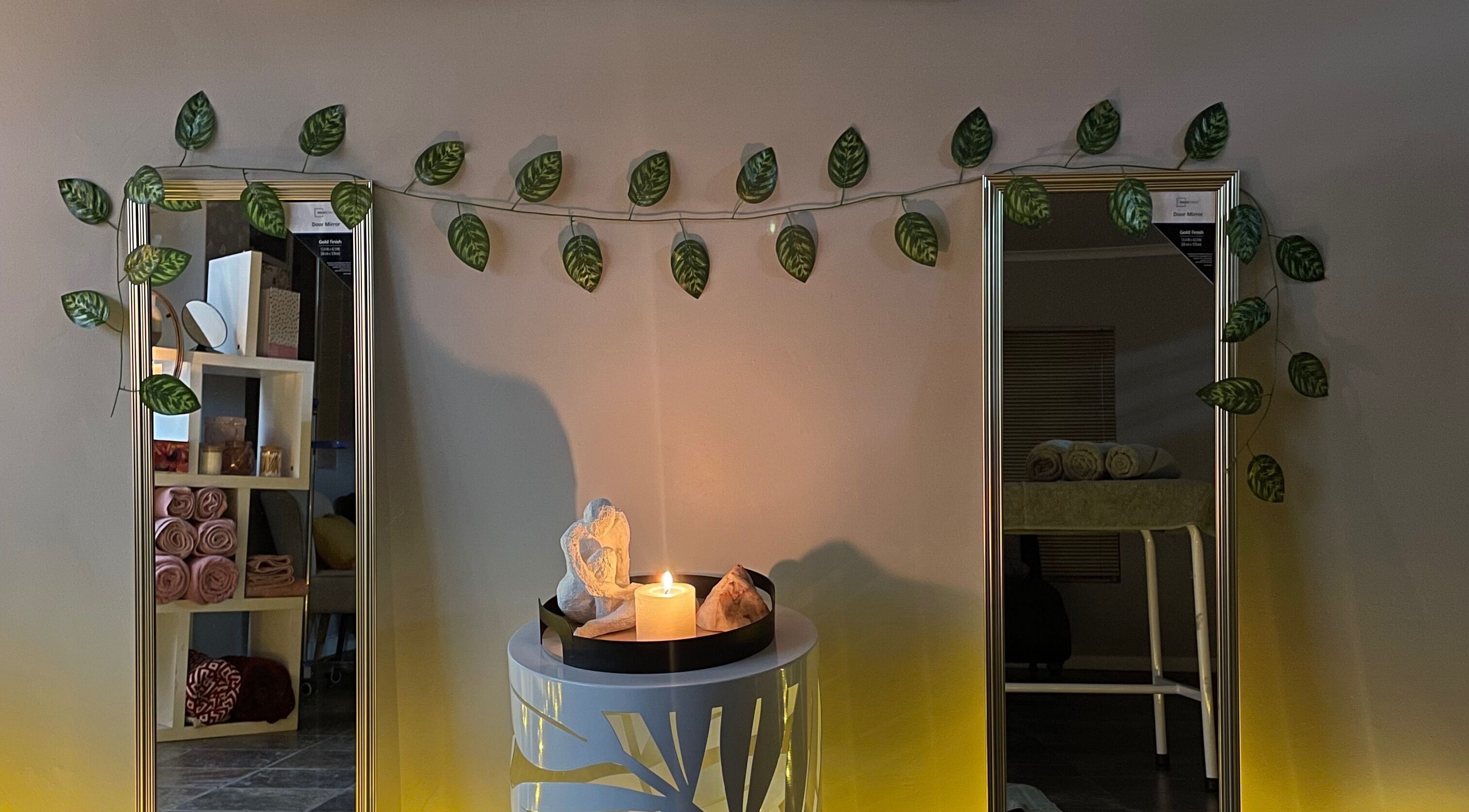 Soothing spa decor with candles and leaves at Wellness Empowerment Bridge Spa, Kimberley, Northern Cape, ZA.