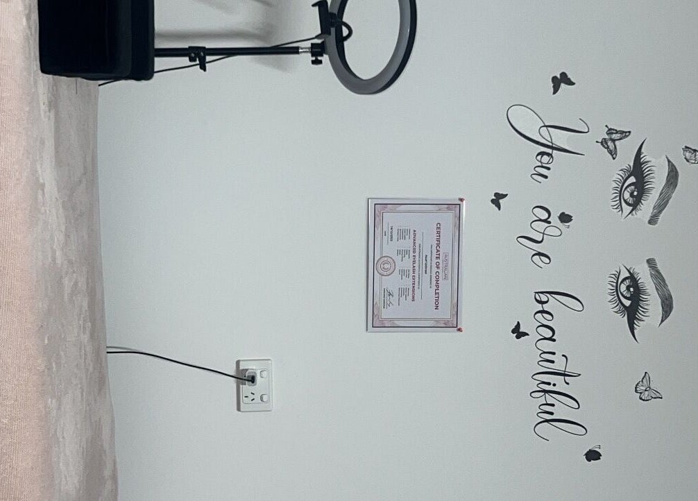 Cozy interior with 'You are beautiful' wall art at Sultan Lashes, Melbourne, Victoria, AU.