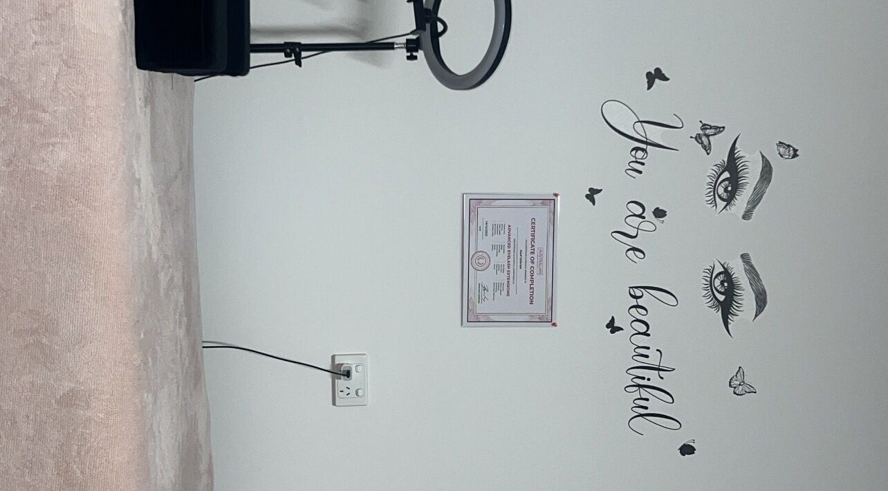 Cozy interior with 'You are beautiful' wall art at Sultan Lashes, Melbourne, Victoria, AU.