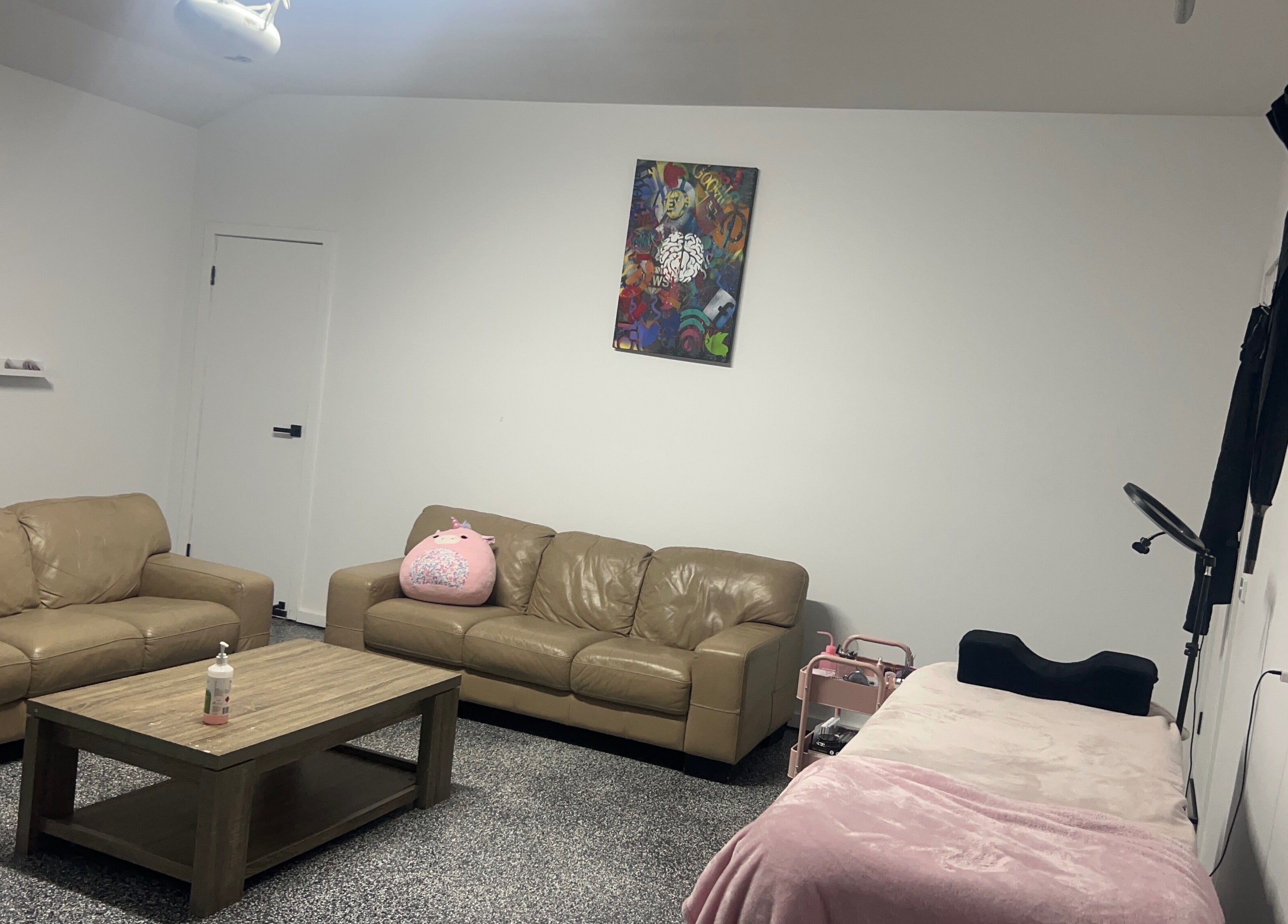 Relaxing lounge at Sultan Lashes, Melbourne, Victoria, AU with comfy sofas and chic decor.