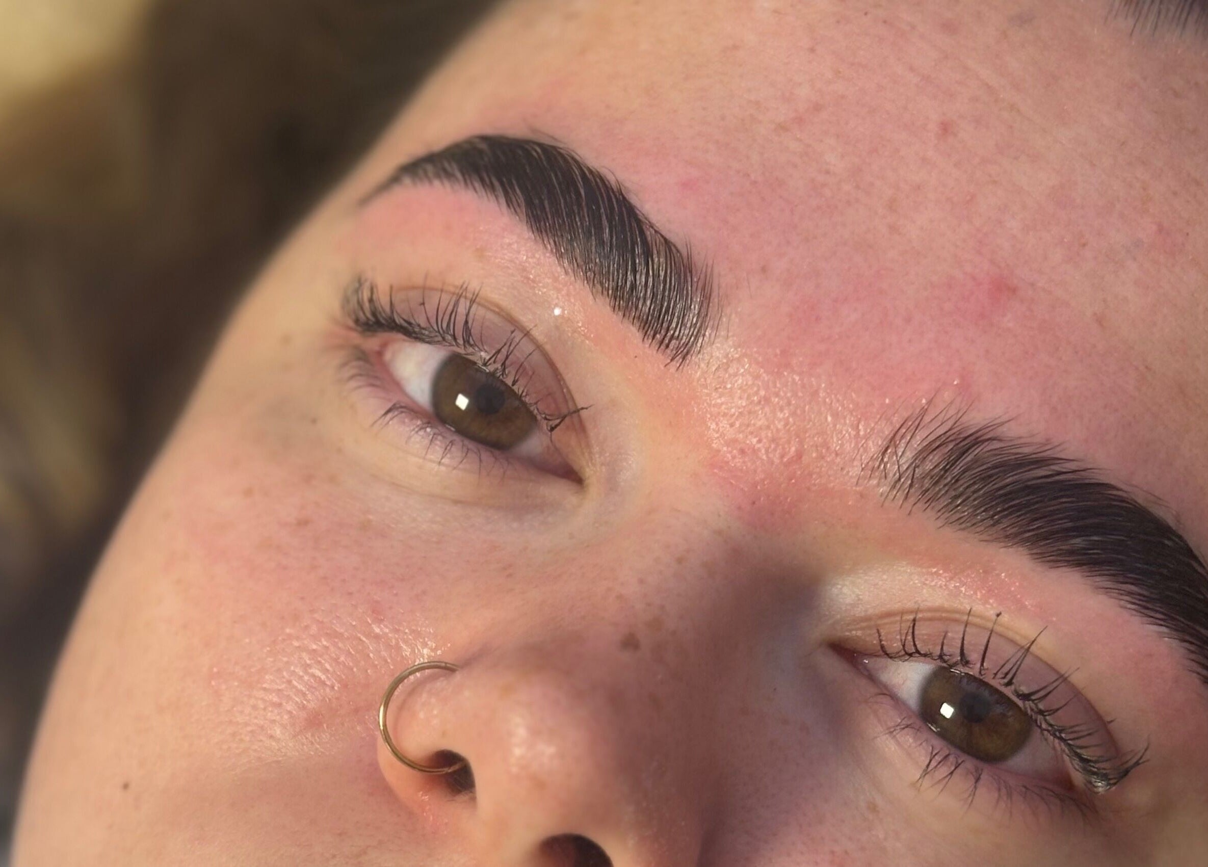 Expert brow shaping at Bambas beauty room, Wallsend, England, GB, highlighting detailed beauty enhancements.