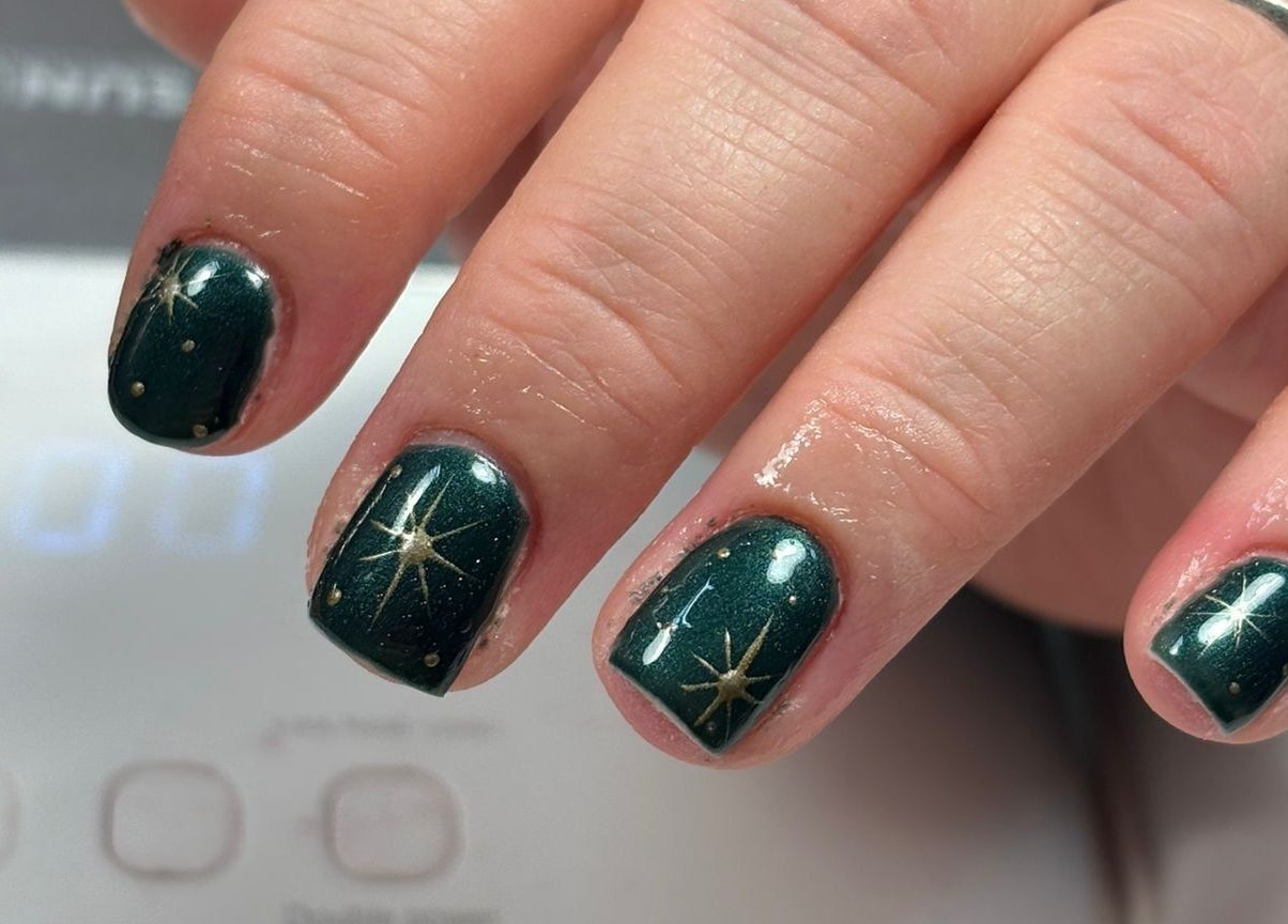 Elegant green nail art with star design at Bambas beauty room, Wallsend, England, GB.