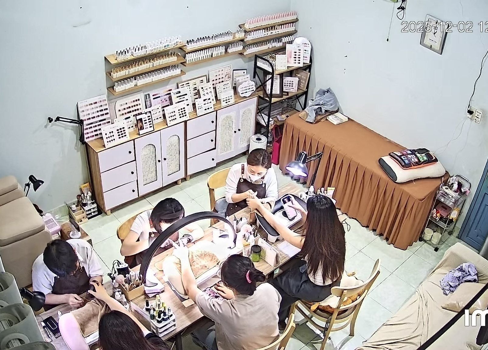 Nail Núp Hẻm bustling with clients receiving nail services in Thành Phố Hồ Chí Minh, Thành Phố Hồ Chí Minh, VN.