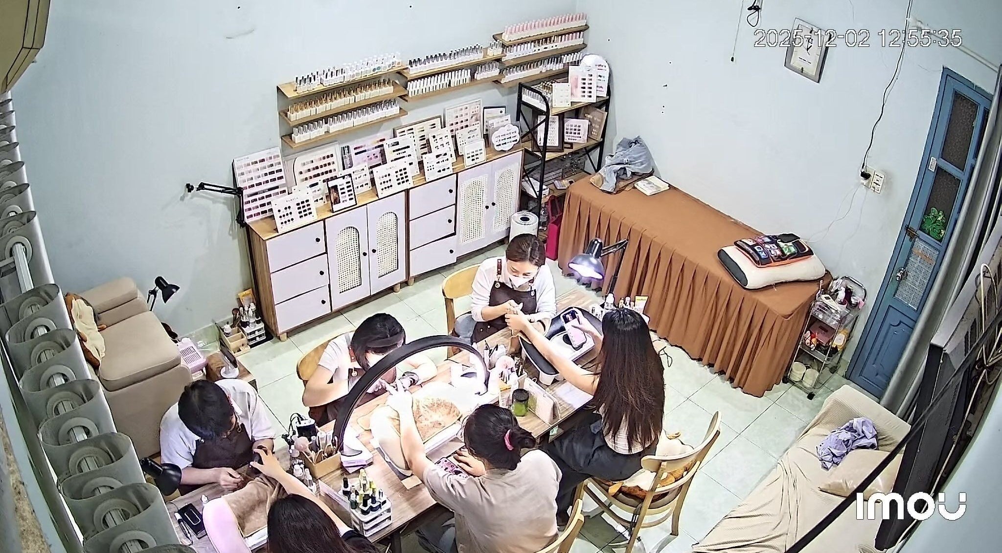 Nail Núp Hẻm bustling with clients receiving nail services in Thành Phố Hồ Chí Minh, Thành Phố Hồ Chí Minh, VN.