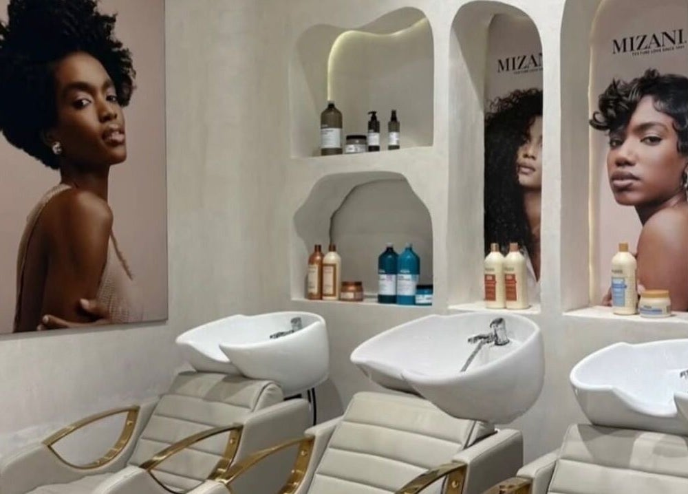 Stylish wash station at The Penthouse Beauty Studio, Sandton, Gauteng, ZA featuring modern salon chairs and products.